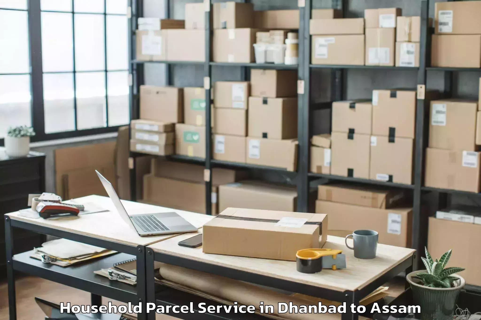 Book Your Dhanbad to Numaligarh Household Parcel Today